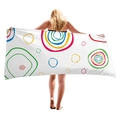 White beach towel with colorful abstract circles and geometric patterns held by a model - Abstract Art Colorful Circles Style