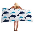 Thick microfiber beach towel featuring blue cartoon whale silhouettes for seaside vacations - Blue And White Dolphin Pattern / 150x75cm