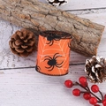 Close-up of orange Halloween ribbon with black spider and white cobweb print patterns - Spider Style / Orange