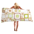Thick beach towel with retro colorful geometric squares shown by a model - Retro Brown-Green Squares (6)