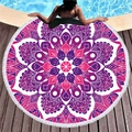Circular mandala beach towel with white fringes displayed by a swimming pool side - Purple-Rose Red Mandala (3)