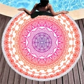 Circular mandala beach towel with red fringe, shown on pool deck for summer vacation - Red Orange Gradient Mandala (2)
