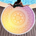 Mandala pattern round beach towel with white tassels on a wooden pool deck - Orange-Purple Gradient Mandala (2)