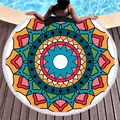 Colorful mandala pattern round beach towel with white tassels on a wooden terrace - Vibrant Multicolor Mandala (6)