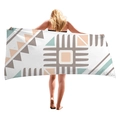 Avocado green geometric square thick beach towel wrap shown on a female model back view - Morandi Geometric Patchwork (7)