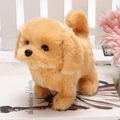 Golden plush electronic toy dog standing by white fence in a warm decorative setting - Yellow