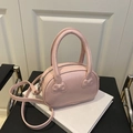 Pink shell-shaped handbag with bow details and adjustable crossbody strap - Pink