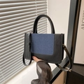Sac cabas bicolore en denim bleu marine et cuir noir pour femme, style moderne - Noir