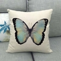 Linen cushion cover with realistic light blue and yellow butterfly on a grey sofa - Light Blue Yellow Gradient Butterfly (2) / 45x45cm