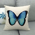 Linen decorative square pillowcase featuring a vibrant blue butterfly on a gray sofa - Blue Gradient Butterfly (4) / 45x45cm