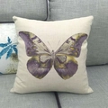 Detail view of purple butterfly print on beige linen cushion cover on a grey sofa - Purple Butterfly (10) / 45x45cm