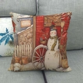 Winter snowman linen cushion cover with potting shed illustration on a gray sofa - Snowman and Barn (3)