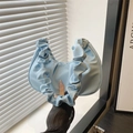 Light blue crescent handbag with ruffle pleated handle and minimalist design - Blue