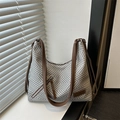 Minimalist herringbone tote bag with brown leather straps shown in natural window light - Gray