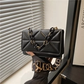 Black quilted crossbody bag with stylish resin chain handle and wide graphic strap - Black