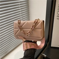 Pink quilted crossbody bag with stylish chunky resin chain and wide patterned strap - Pink