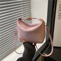 Pink shoulder bag with vertical pleated texture and elegant golden metal clasp detail - Pink