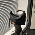 Minimalist black pleated PU shoulder bag with vertical texture and gold hardware details - Black