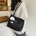 Black quilted tote bag with white bow patterns and a cloud plush charm on shoulder - With Plush Cloud Pendant Style / Black