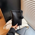 Minimalist black pebble leather mobile phone crossbody bag with stylish knot shoulder strap - Black