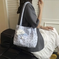 Quilted light blue tote bag with black bow embroidery and woven shoulder strap - With Plush Cloud Pendant Style / Blue