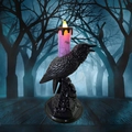 Detail of Halloween LED candle lamp with realistic black crow and purple spider web motif - Purple