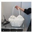 Detail of white tote bag featuring black bow patterns and elegant pearl lace pendant - With Pearl Lace Charm / White
