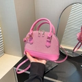 Rosafarbene Muscheltasche mit Webstruktur und Tragegriff für Damen zum Umhängen - Rosa