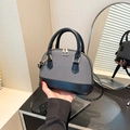 Handtasche in Muschelform aus grauem Canvas und schwarzem Leder mit goldener Hardware - Grau-Schwarz Patchwork (QY6144) / Schwarz