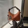 Brown pleated handbag with a scrunchie top handle and adjustable shoulder strap - Brown