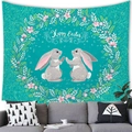 Happy Easter hanging tapestry featuring bunnies and floral wreath over a grey sofa - Turquoise Floral Wreath Rabbit Style (10)