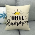 Detail of linen pillow cover with HELLO Summer text and sun print on grey sofa - Hello Summer Sun (8)