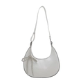 White crescent crossbody bag featuring a silver beaded bow charm and fashion detail - White