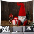 Detailed view of Christmas Gonk tapestry hanging over a sofa with wood grain background - 100X70 / Gnome with Gifts and Dark Brown Wood Grain (15) / Peach Skin