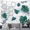 Detail of tropical monstera leaf wall tapestry over a grey sofa in a modern room - 100x70(Peach Skin) / Marble Geometric Monstera (7)