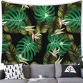 Tropical monstera and palm leaf tapestry hanging on a wall above a grey modern sofa - 100x70cm / Peach Skin / Pattern 4