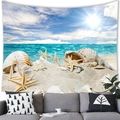 Detail of beach tapestry featuring sea shells and starfish hung over a grey sofa - Clear Water (Style 12)