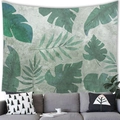 Tropical monstera leaf tapestry wall hanging on grey fabric over a modern sofa - 100x70cm / Peach Skin / Pattern 9