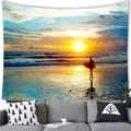 Detail of tropical sunset beach tapestry hanging above a grey sofa in a living room - Sunset Beach Surfer Style (14)