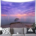Detail of tropical sunset beach tapestry with ship and sea behind a modern grey sofa - Dreamy Purple Orange Sunset Ship Style (12)