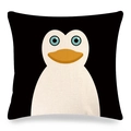 Detailed close-up of a square linen pillowcase with a cartoon penguin print on black - Penguin Style