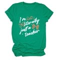 Close-up of green teacher T-shirt with I'm literally just a teacher print and leopard bows - S / Tops / Dark Green