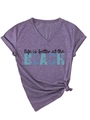Detail of V-neck heather purple t-shirt with knotted hem and BEACH slogan print - S / Heather Purple