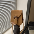 Dark brown matte leather mini crossbody bag featuring a vintage wood-grain buckle clasp - Brown