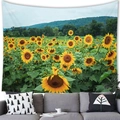 Sunflower field tapestry with mountains and blue sky hanging above a grey sofa - 100x70(Peach Skin) / Sunflower Mountains Style