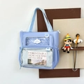 Hellblaue Ita Bag Schultertasche mit zwei Klarsichtfenstern und Wolken-Logo-Detail - Blau