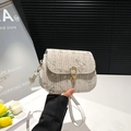 Cream woven straw bag with delicate floral embroidery and gold metal clasp closure - Khaki