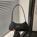 Elegant black PU leather underarm bag featuring a silver metal bow accent and shoulder strap - Black