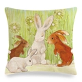 Easter linen pillow cover featuring watercolor rabbits on a green meadow background - Four Rabbits with Dandelions (Style 15)