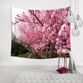 Detail of cherry blossom tapestry hung on a white brick wall in a cozy room setting - Blossoming Pink Sakura (10)